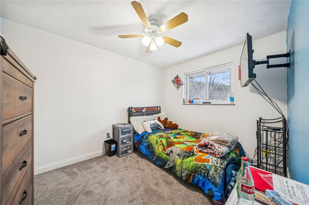 190 Urban Road Saltsburg, PA 15681 - Photo 16 of 44 a bedroom with bed and a chandelier