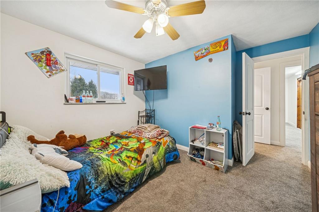 190 Urban Road Saltsburg, PA 15681 - Photo 17 of 44 a bedroom with a bed and a chandelier