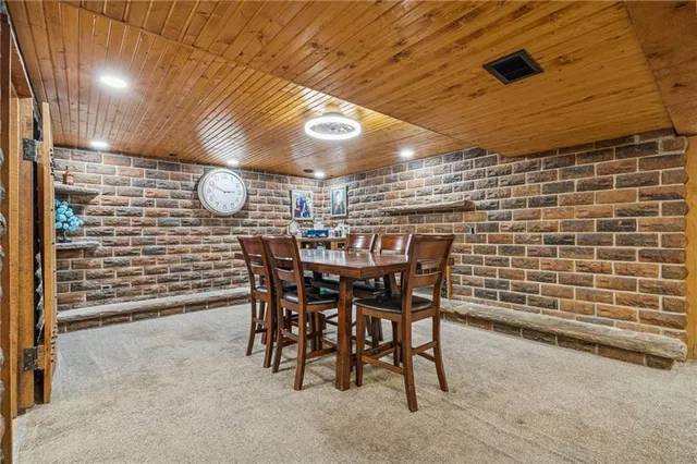 a view of a wooden table and chairs
