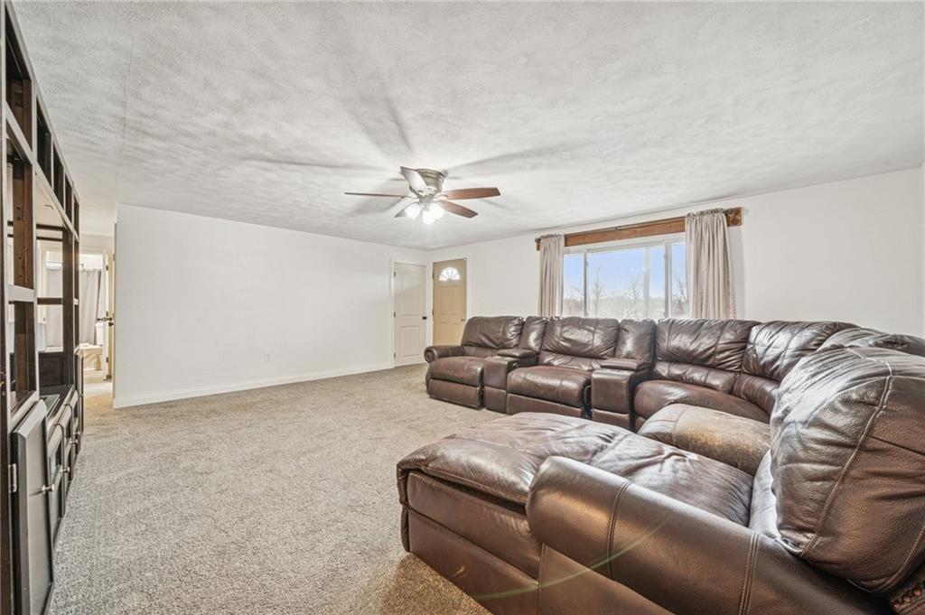 190 Urban Road Saltsburg, PA 15681 - Photo 4 of 44 a living room with furniture and a ceiling fan