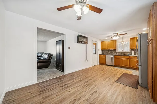 a kitchen with a refrigerator and a sink