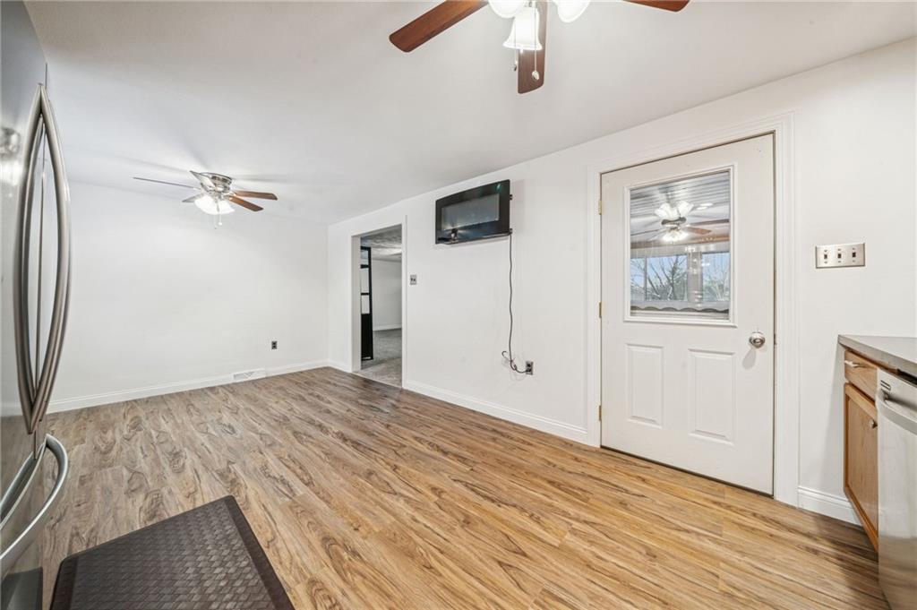 190 Urban Road Saltsburg, PA 15681 - Photo 8 of 44 a view of a livingroom with wooden floor and ceiling fan