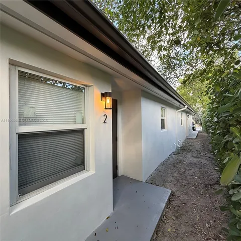 a view of backyard of the house