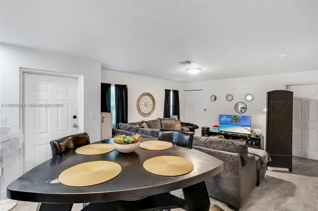 a living room with furniture and a table