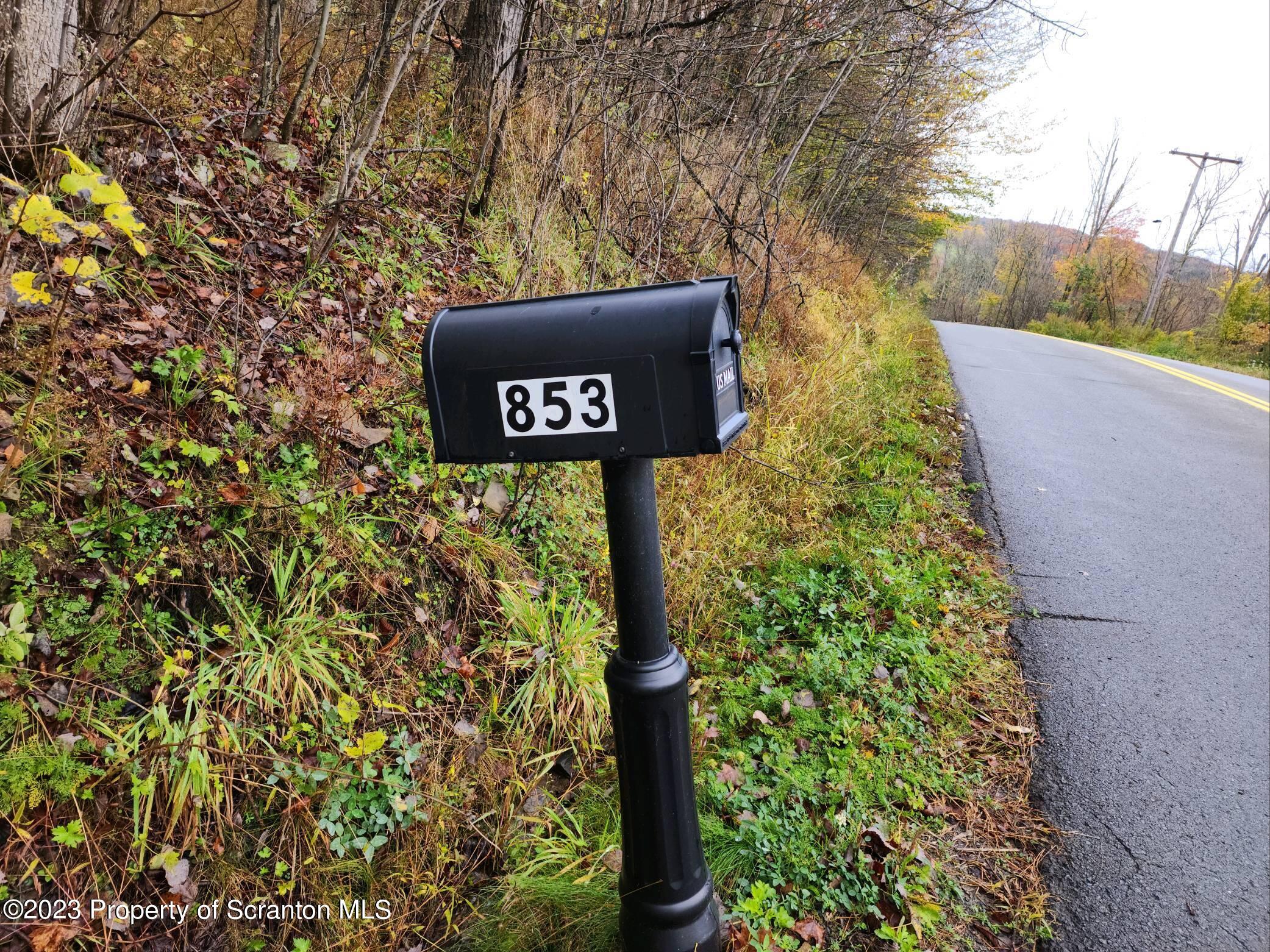 853 Silver Creek Road Montrose, PA 18801 - Photo 19 of 20 a sign that is sitting on a brick wall