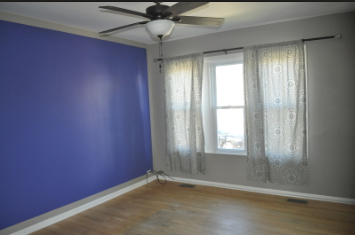 5017 West 29th Street Cicero, IL 60804 - Photo 13 of 17 an empty room with windows and fan