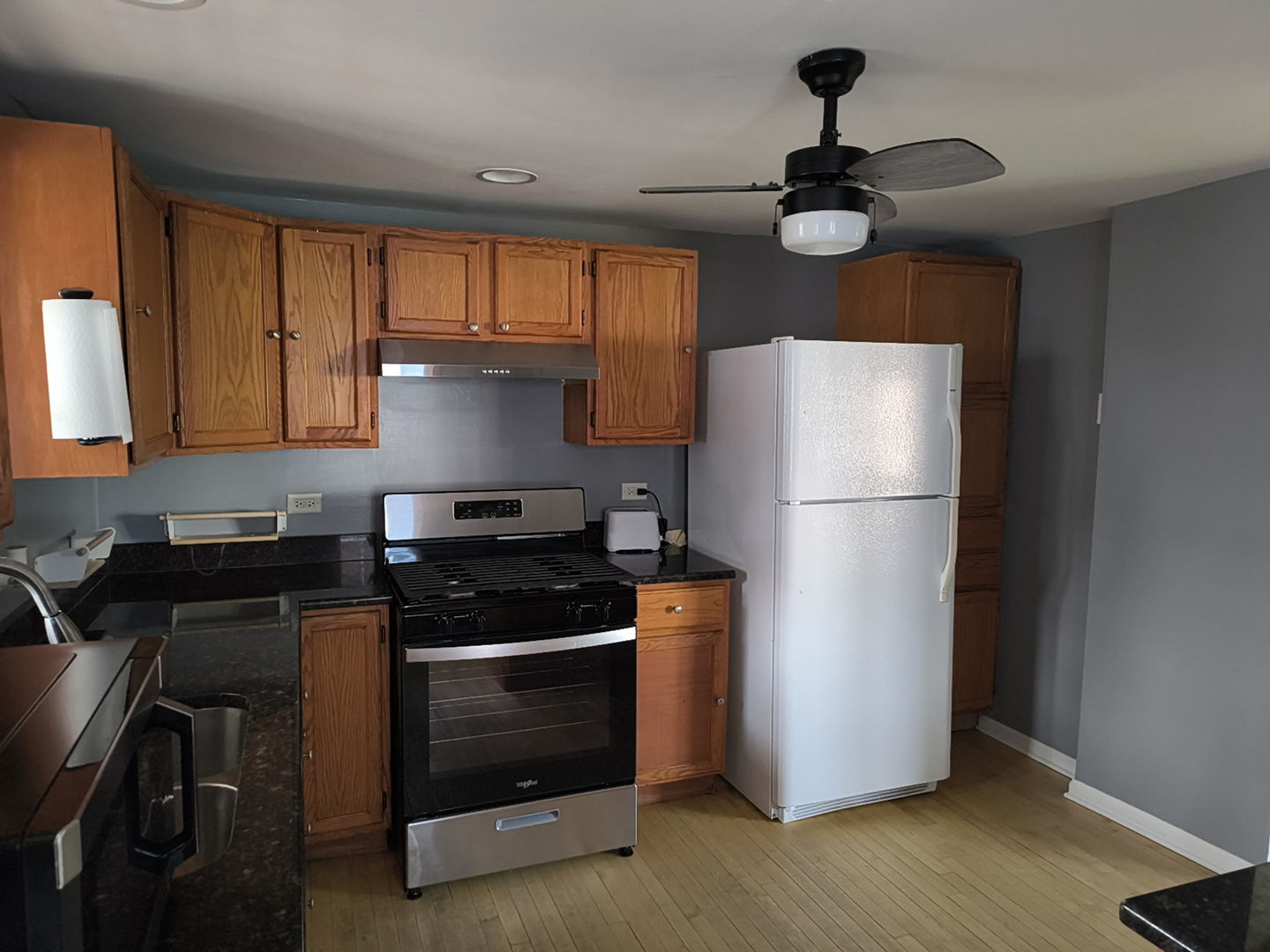 5017 West 29th Street Cicero, IL 60804 - Photo 3 of 17 a kitchen with a refrigerator a stove a sink and a microwave