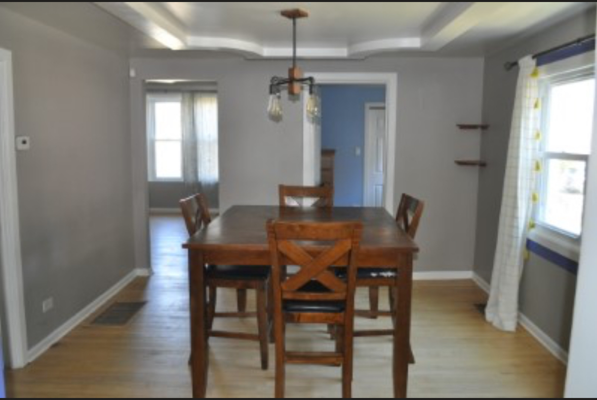 5017 West 29th Street Cicero, IL 60804 - Photo 9 of 17 a view of a dining room with furniture window and wooden floor