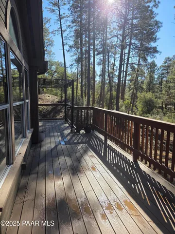 a view of balcony with wooden floor