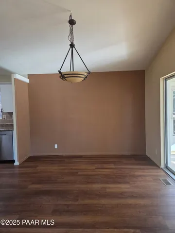 a kitchen with a refrigerator stove and microwave