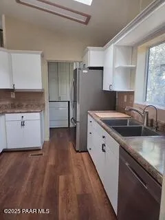 a bathroom with a sink vanity and a mirror