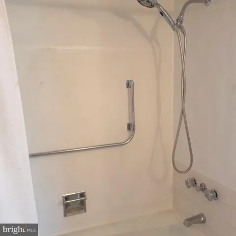 a view of staircase with white walls