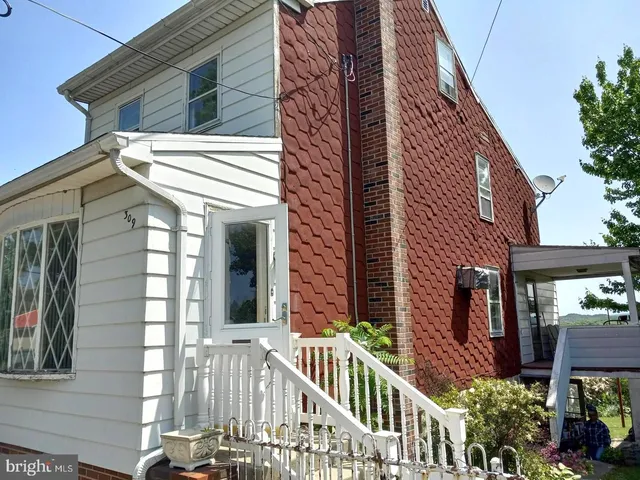 a view of a house with brick walls