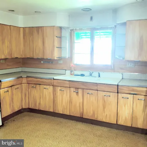 a view of a kitchen with a sink