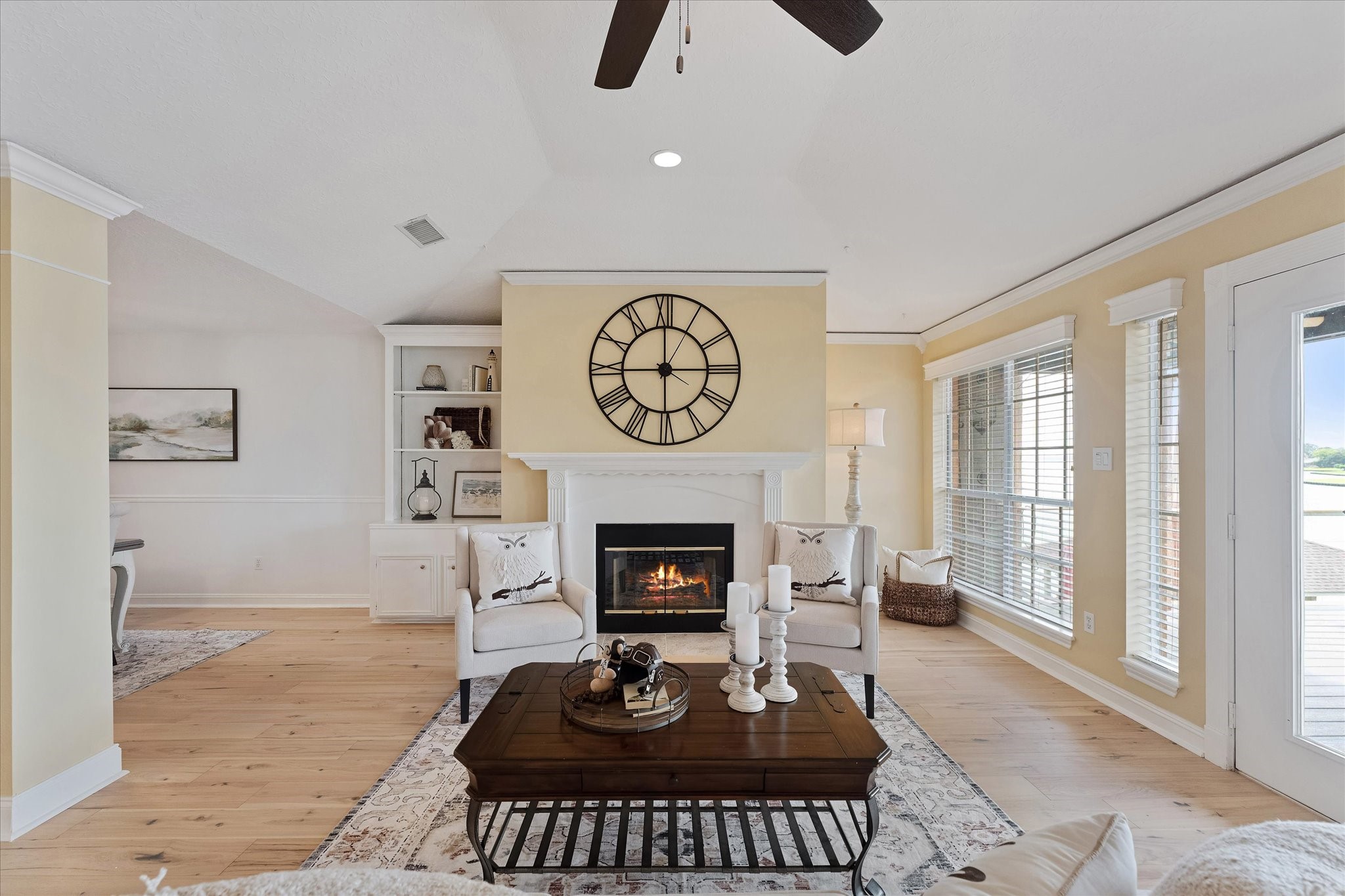 225 Capetown Conroe, TX 77356 - Photo 11 of 38 a living room with furniture a rug and a fireplace