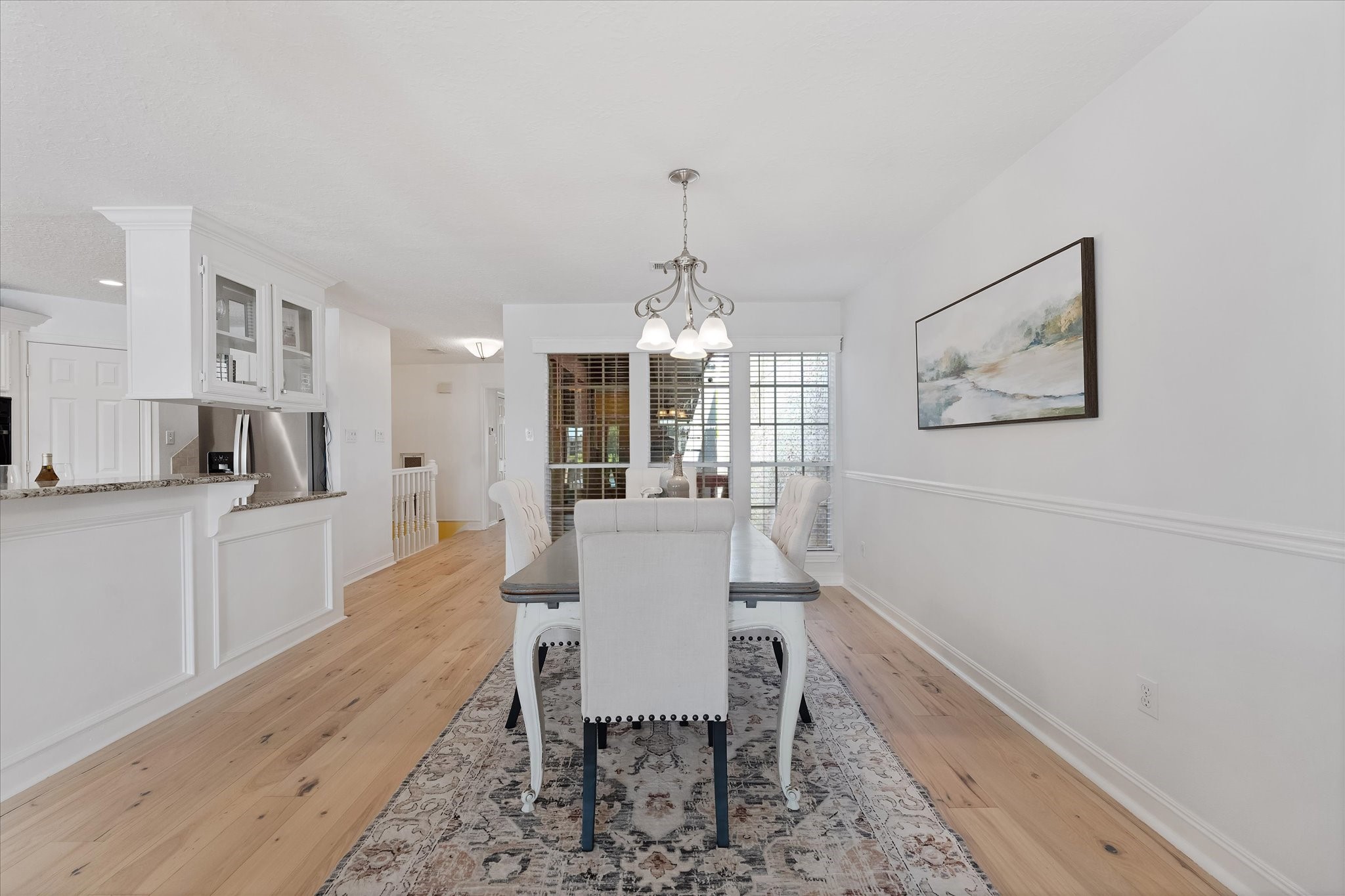 225 Capetown Conroe, TX 77356 - Photo 12 of 38 a view of a dining room with furniture and wooden floor