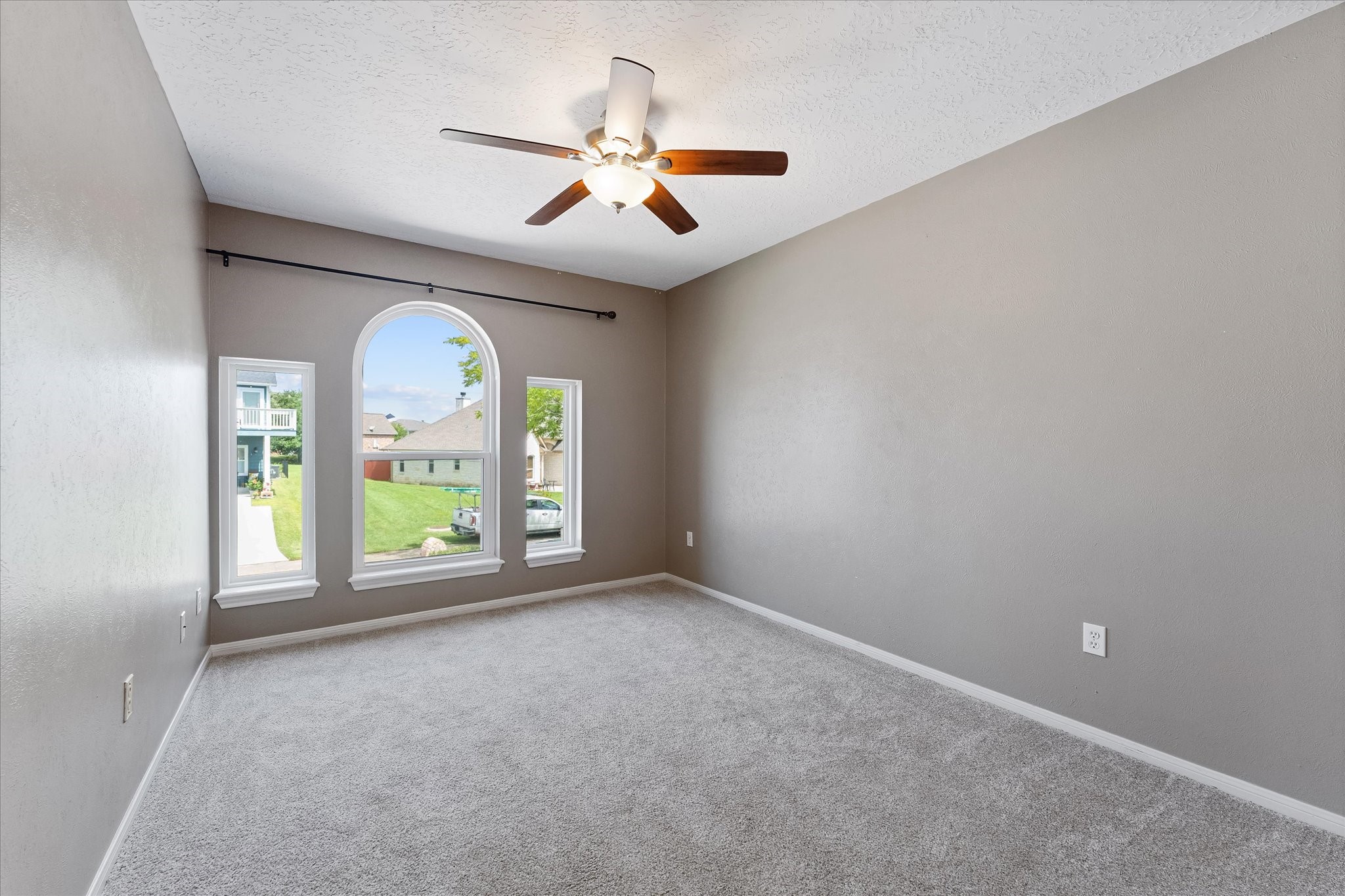 225 Capetown Conroe, TX 77356 - Photo 18 of 38 an empty room with windows and ceiling fan