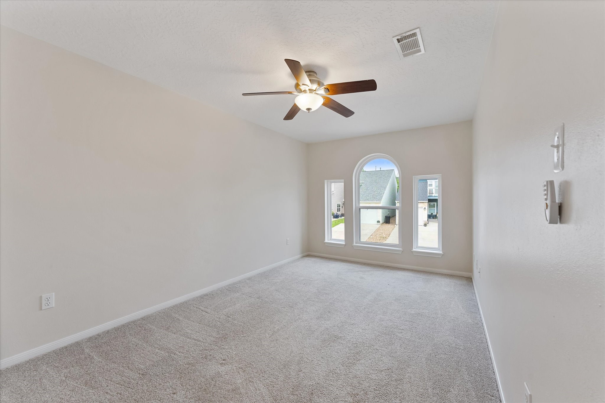 225 Capetown Conroe, TX 77356 - Photo 22 of 38 a view of a room with window ceiling fan and windows