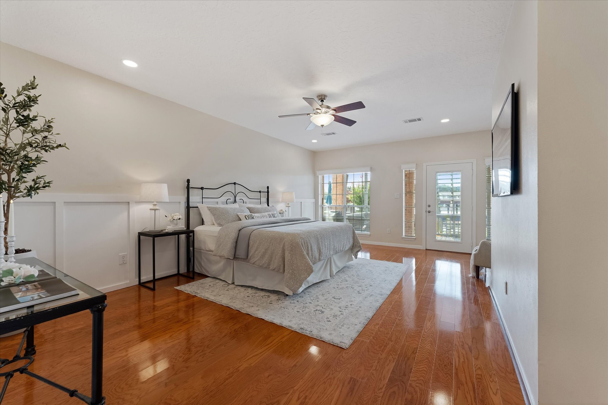 225 Capetown Conroe, TX 77356 - Photo 23 of 38 a bedroom with a bed and a chandelier