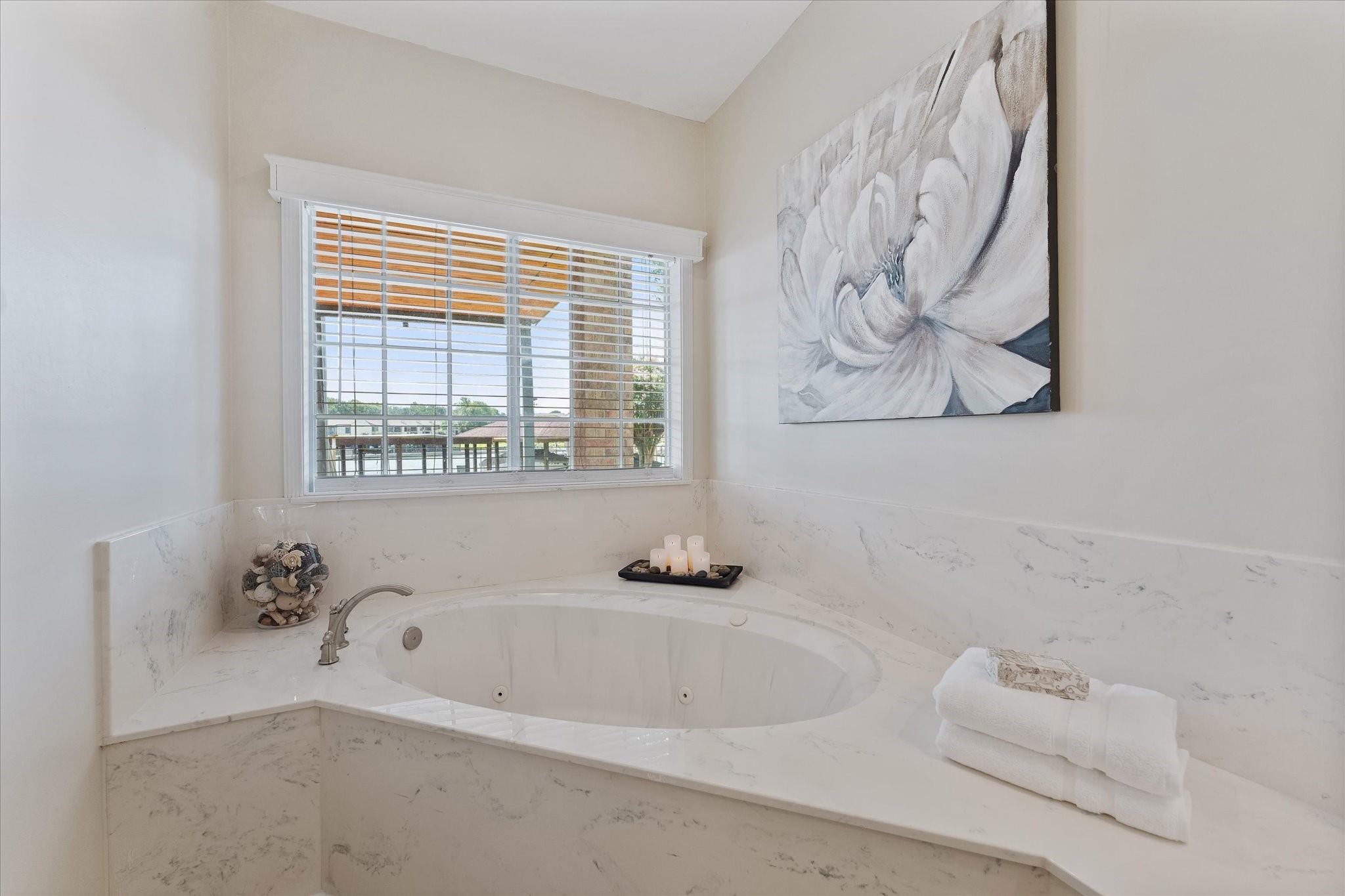 225 Capetown Conroe, TX 77356 - Photo 30 of 38 a bathroom with a bathtub and a window