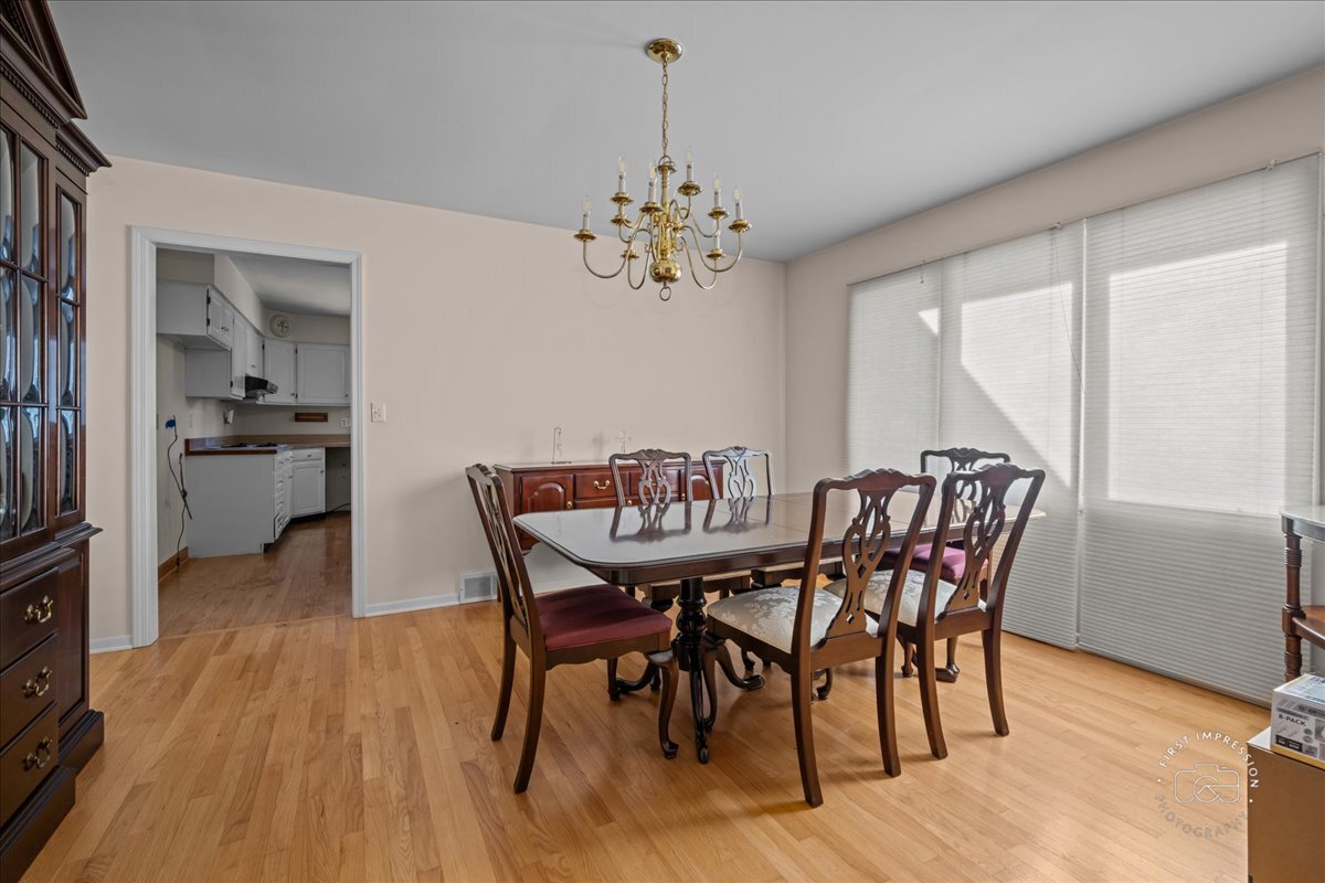 36 Winthrop New Road Sugar Grove, IL 60554 - Photo 13 of 32 a view of a dining room with furniture window and wooden floor