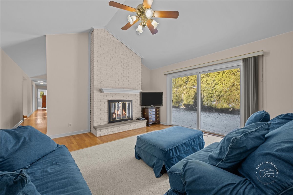 36 Winthrop New Road Sugar Grove, IL 60554 - Photo 6 of 32 a living room with furniture and a fireplace
