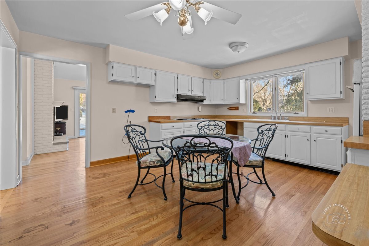 36 Winthrop New Road Sugar Grove, IL 60554 - Photo 9 of 32 a view of a dining room with furniture and wooden floor