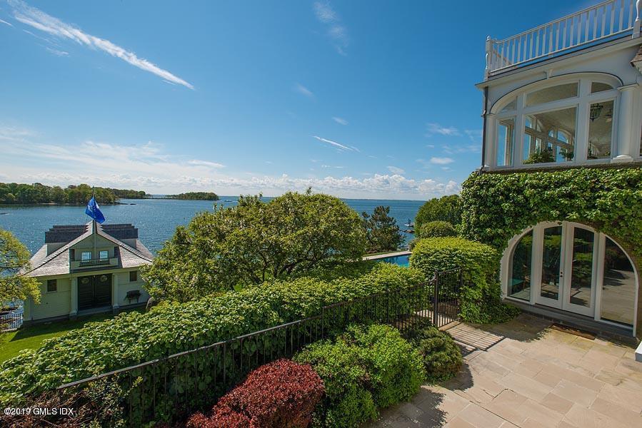 75 Byram Shore Road Greenwich, CT 06830 - Photo 18 of 33 an aerial view of a house with a yard