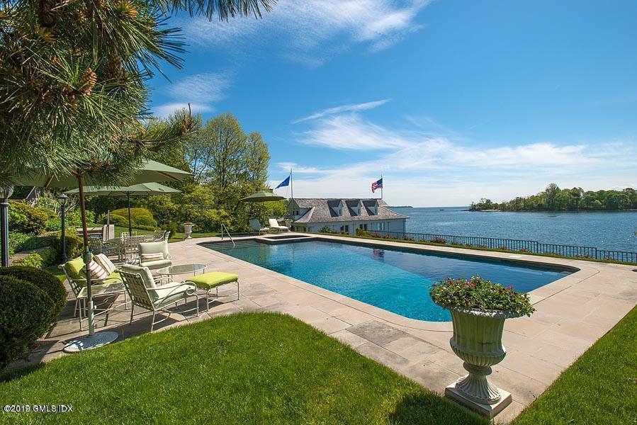 75 Byram Shore Road Greenwich, CT 06830 - Photo 27 of 33 a view of a swimming pool with a lounge chairs