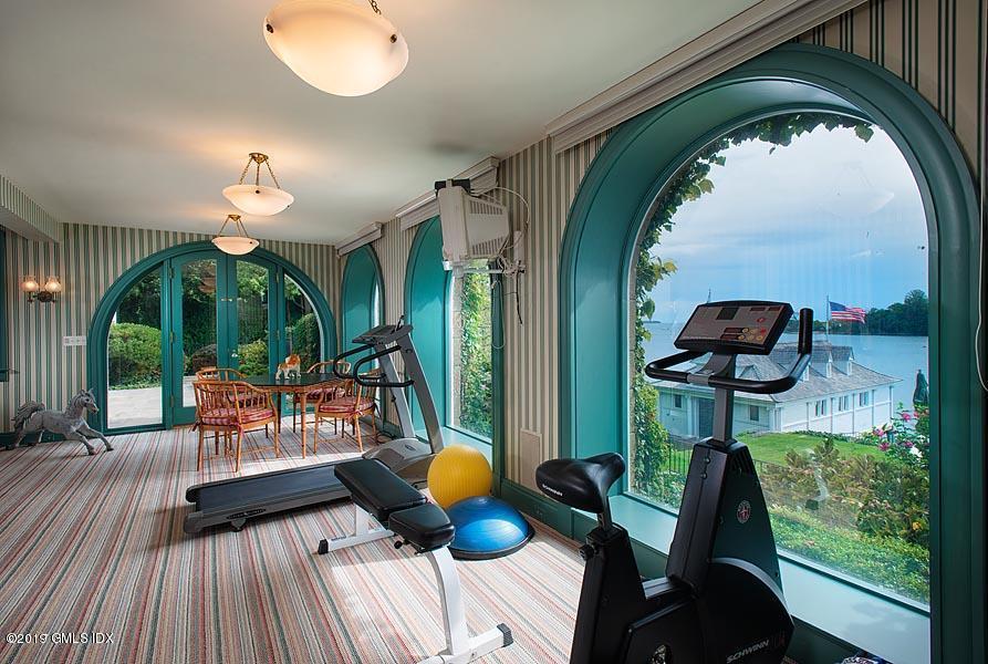 75 Byram Shore Road Greenwich, CT 06830 - Photo 30 of 33 a living room with furniture and a chandelier