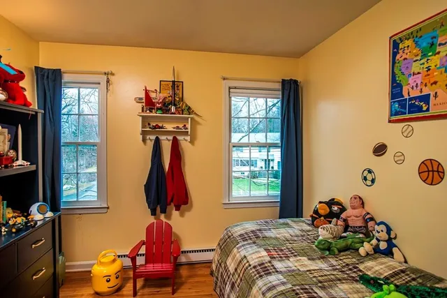 a bedroom with bed and a window