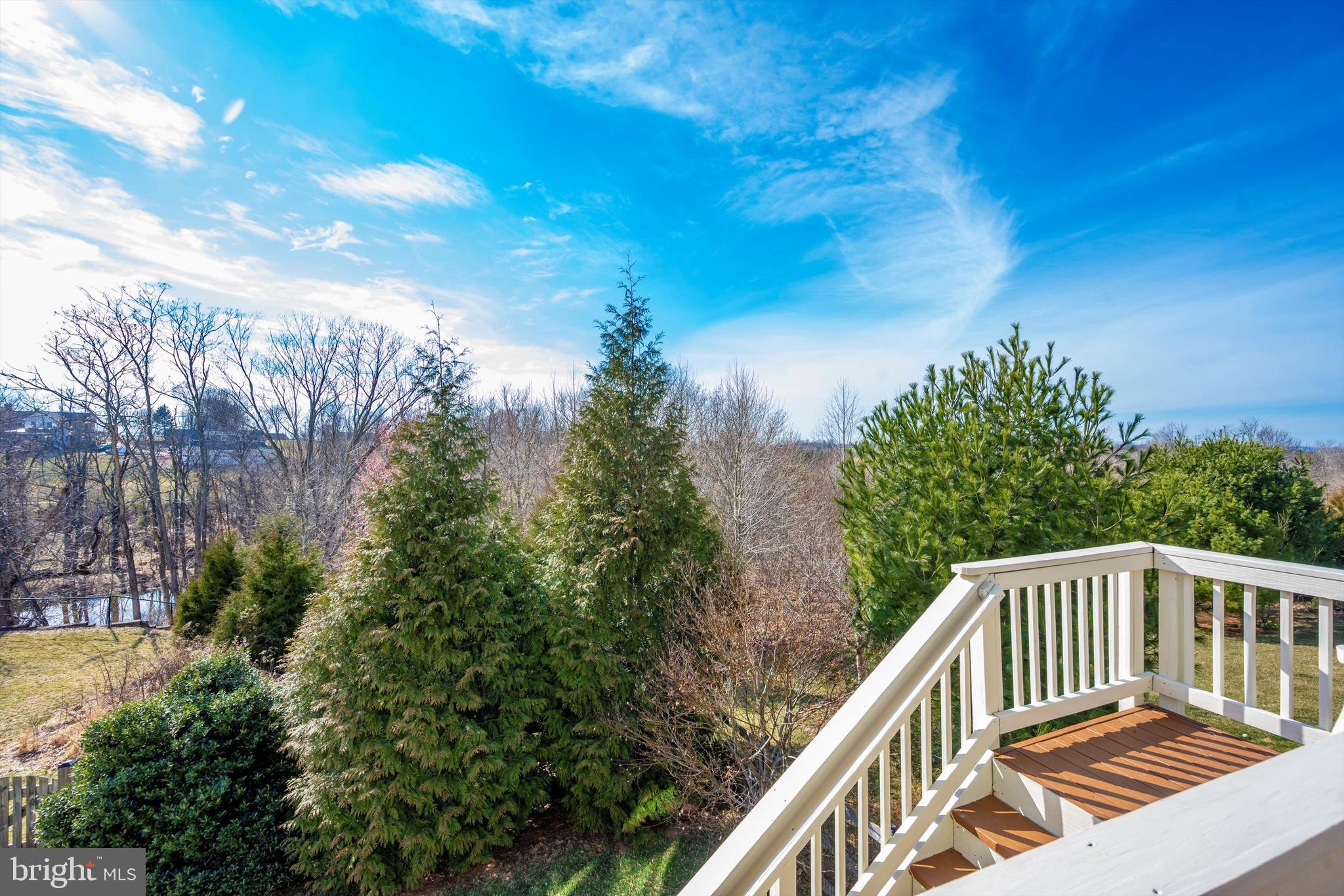 9121 Bealls Farm Road Frederick, MD 21704 - Photo 46 of 63 a balcony with wooden floor and fence