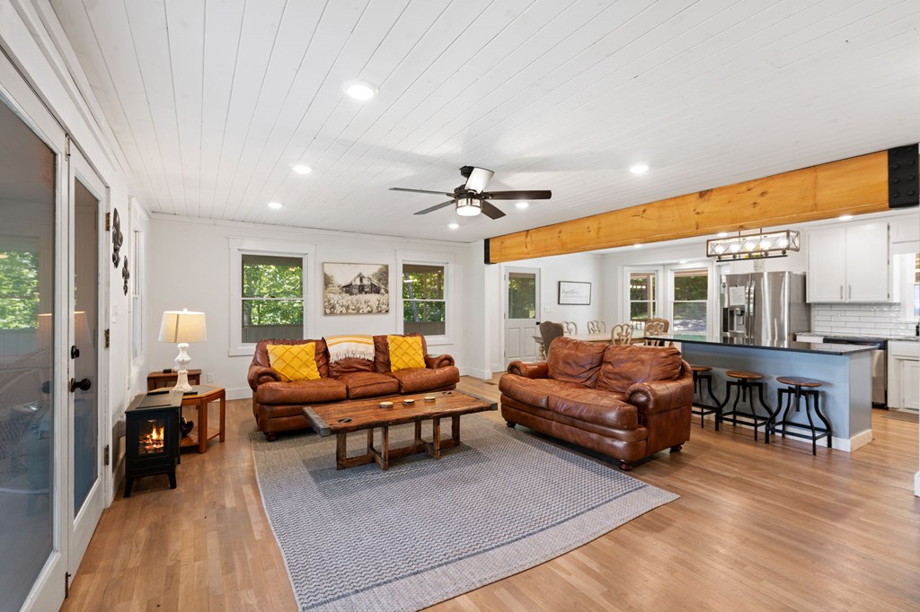 760 River Bend Lane Blue Ridge, GA 30513 - Photo 17 of 101 a living room with furniture ceiling fan and a large window