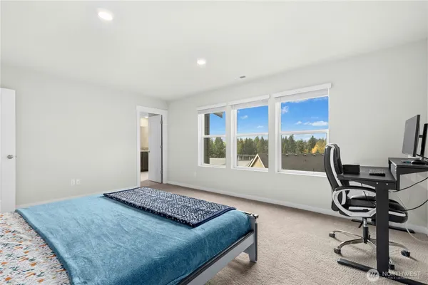 a bedroom with furniture and a window