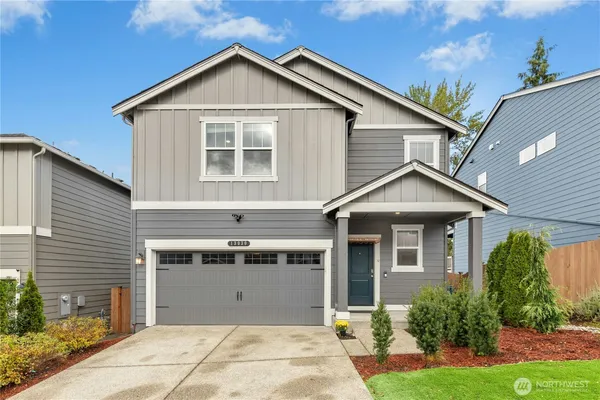 a front view of a house with a yard