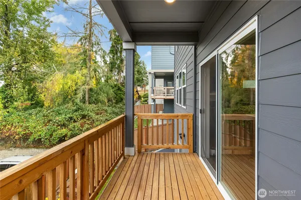 a view of a balcony with wooden floor