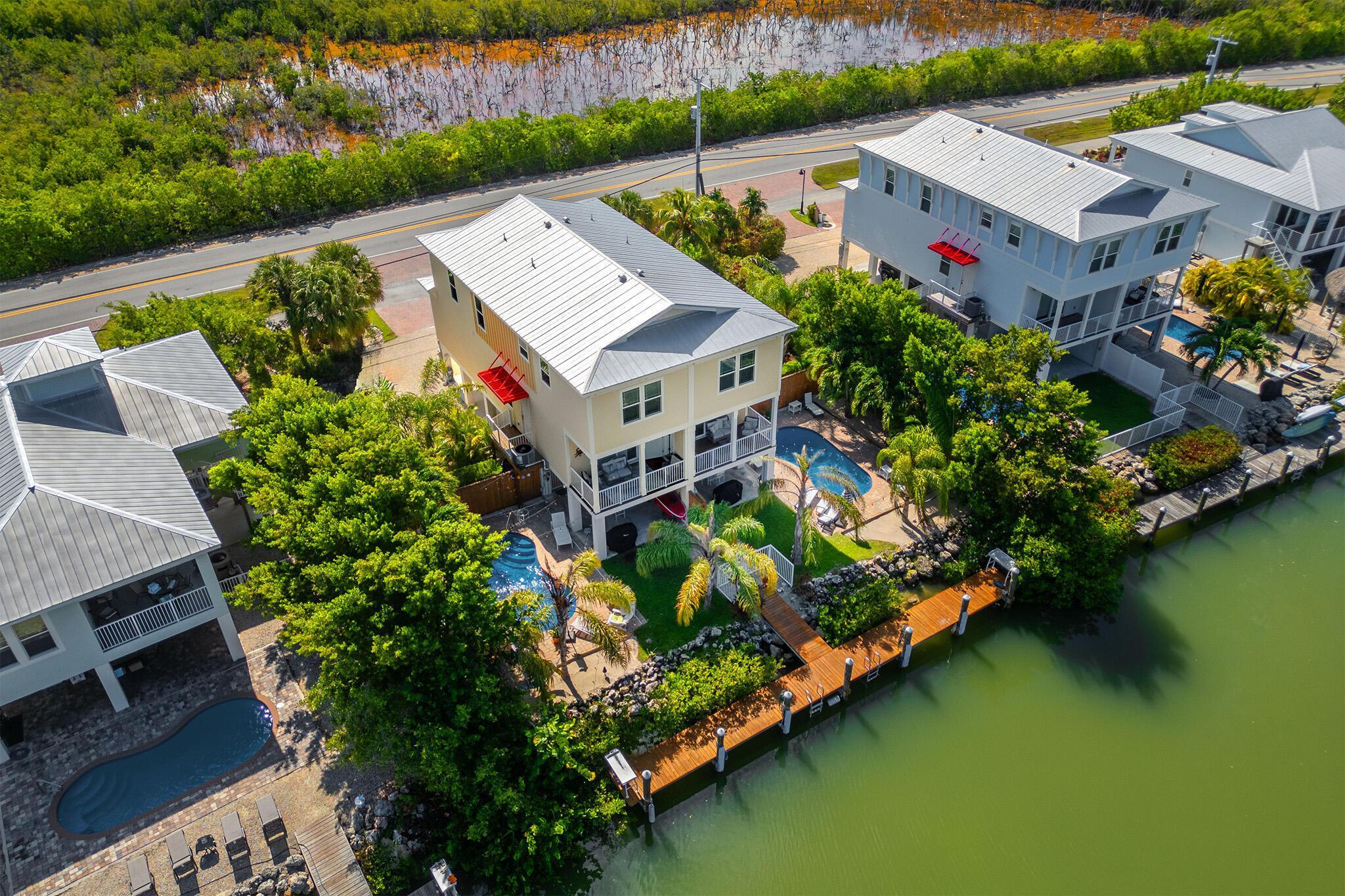 217 Sombrero Beach Road, Unit 1 & 2 Marathon, FL 33050 - Photo 19 of 67 an aerial view of a house with a garden and lake view