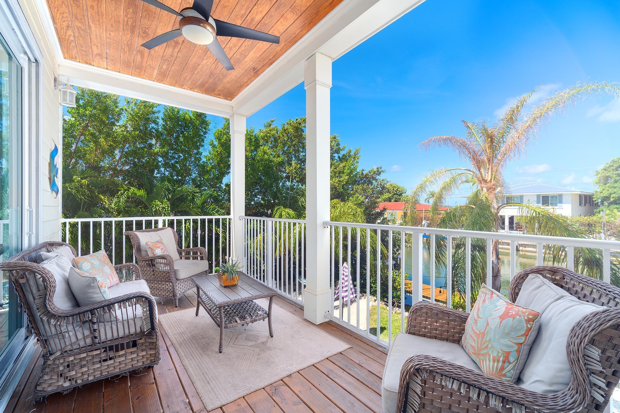 217 Sombrero Beach Road, Unit 1 & 2 Marathon, FL 33050 - Photo 28 of 67 a balcony with furniture and a potted plant