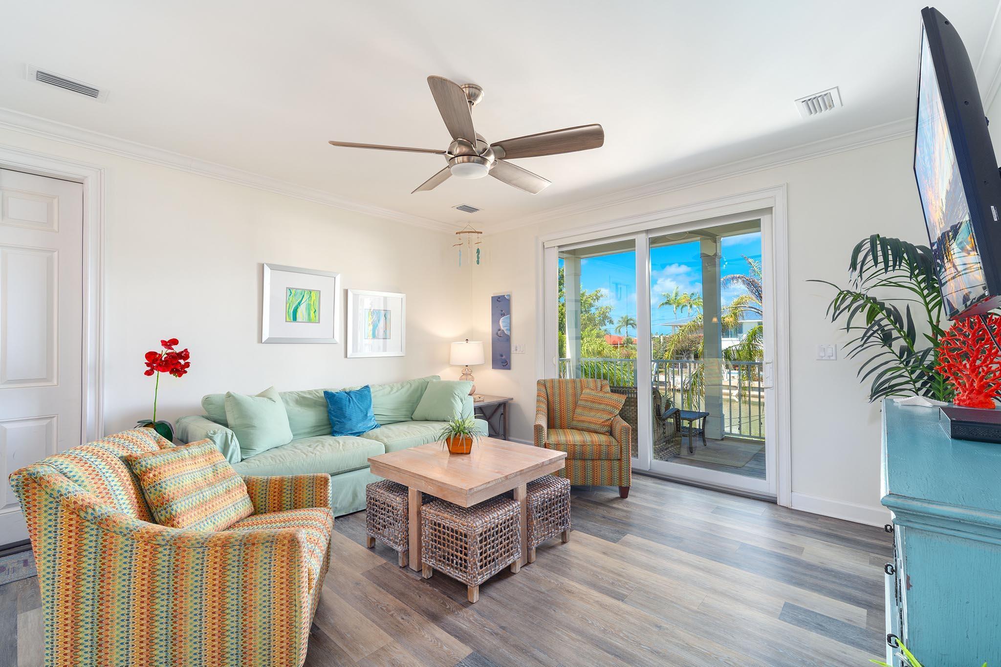 217 Sombrero Beach Road, Unit 1 & 2 Marathon, FL 33050 - Photo 30 of 67 a living room with furniture and a large window