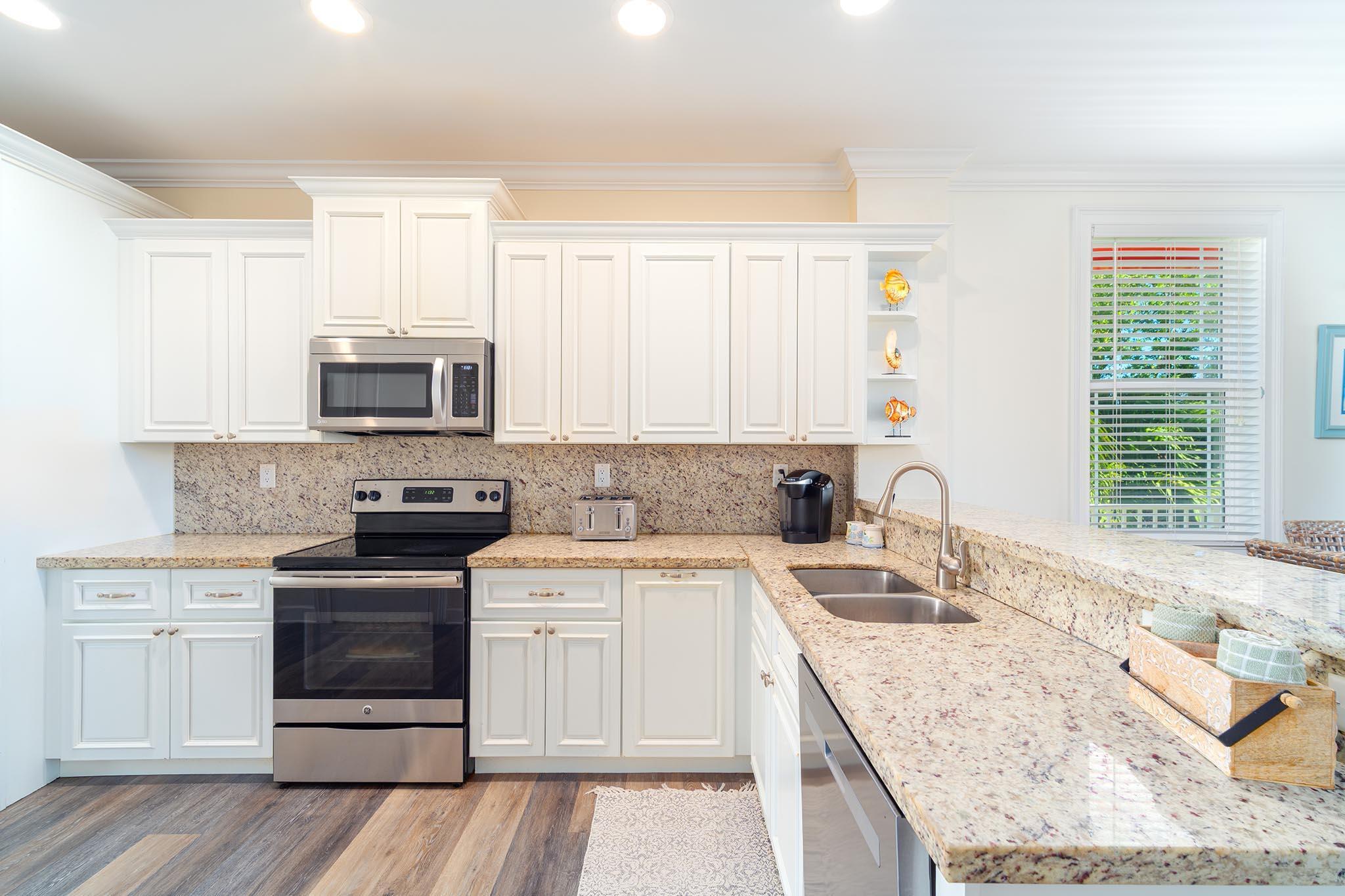 217 Sombrero Beach Road, Unit 1 & 2 Marathon, FL 33050 - Photo 38 of 67 a kitchen with a sink stove top oven and cabinets