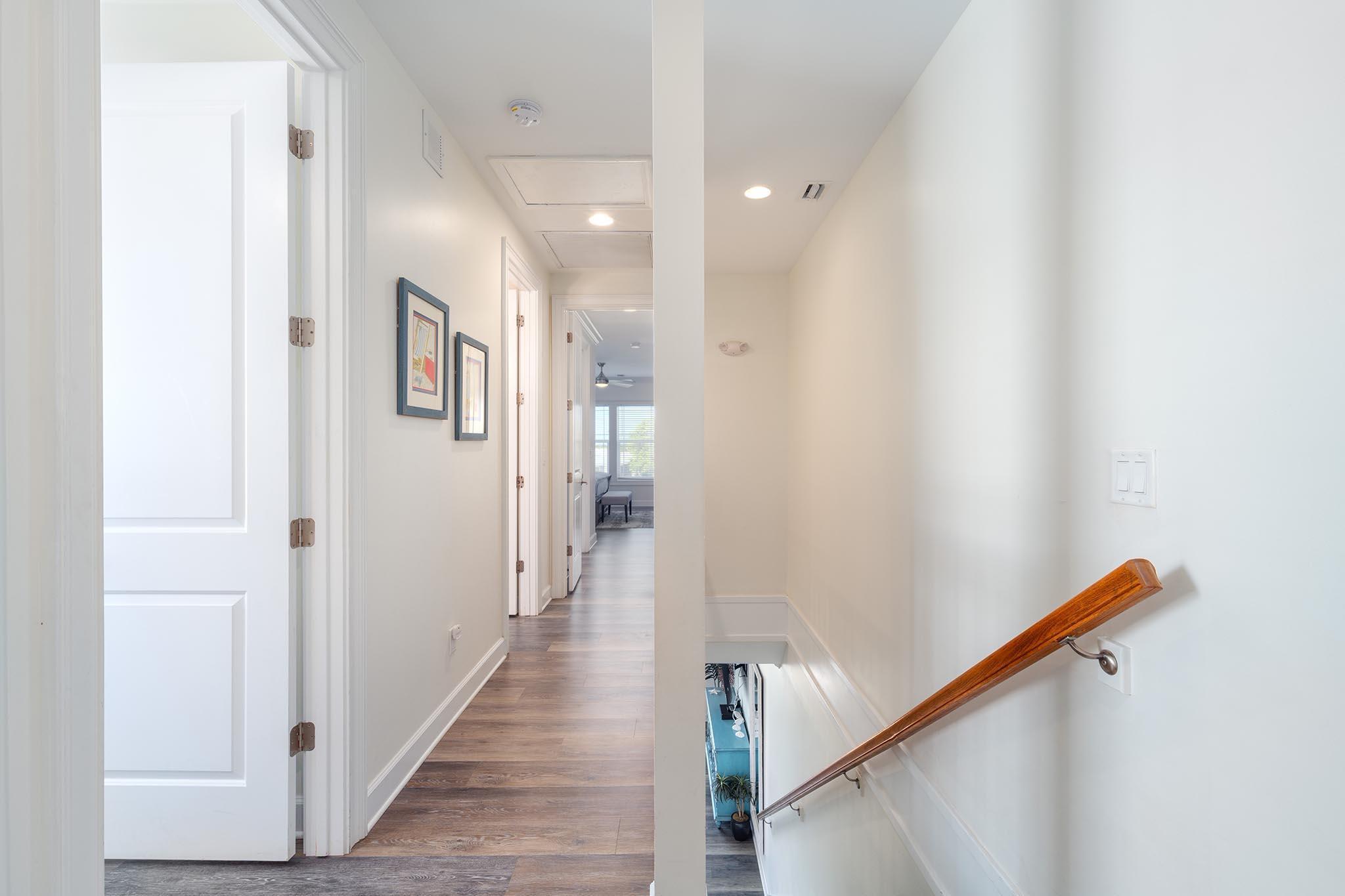 217 Sombrero Beach Road, Unit 1 & 2 Marathon, FL 33050 - Photo 42 of 67 a view of a hallway with wooden floor and staircase