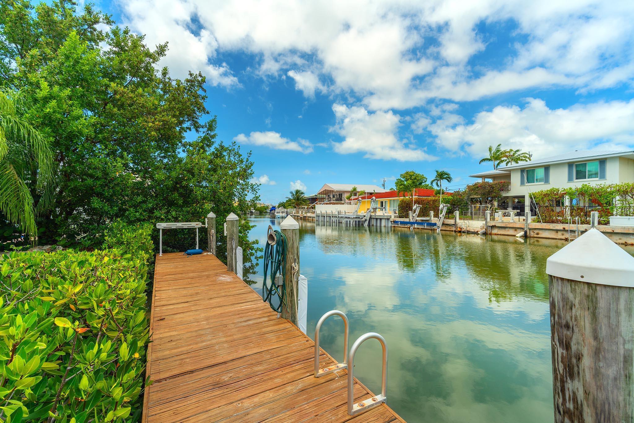 217 Sombrero Beach Road, Unit 1 & 2 Marathon, FL 33050 - Photo 55 of 67 a view of a lake with a yard