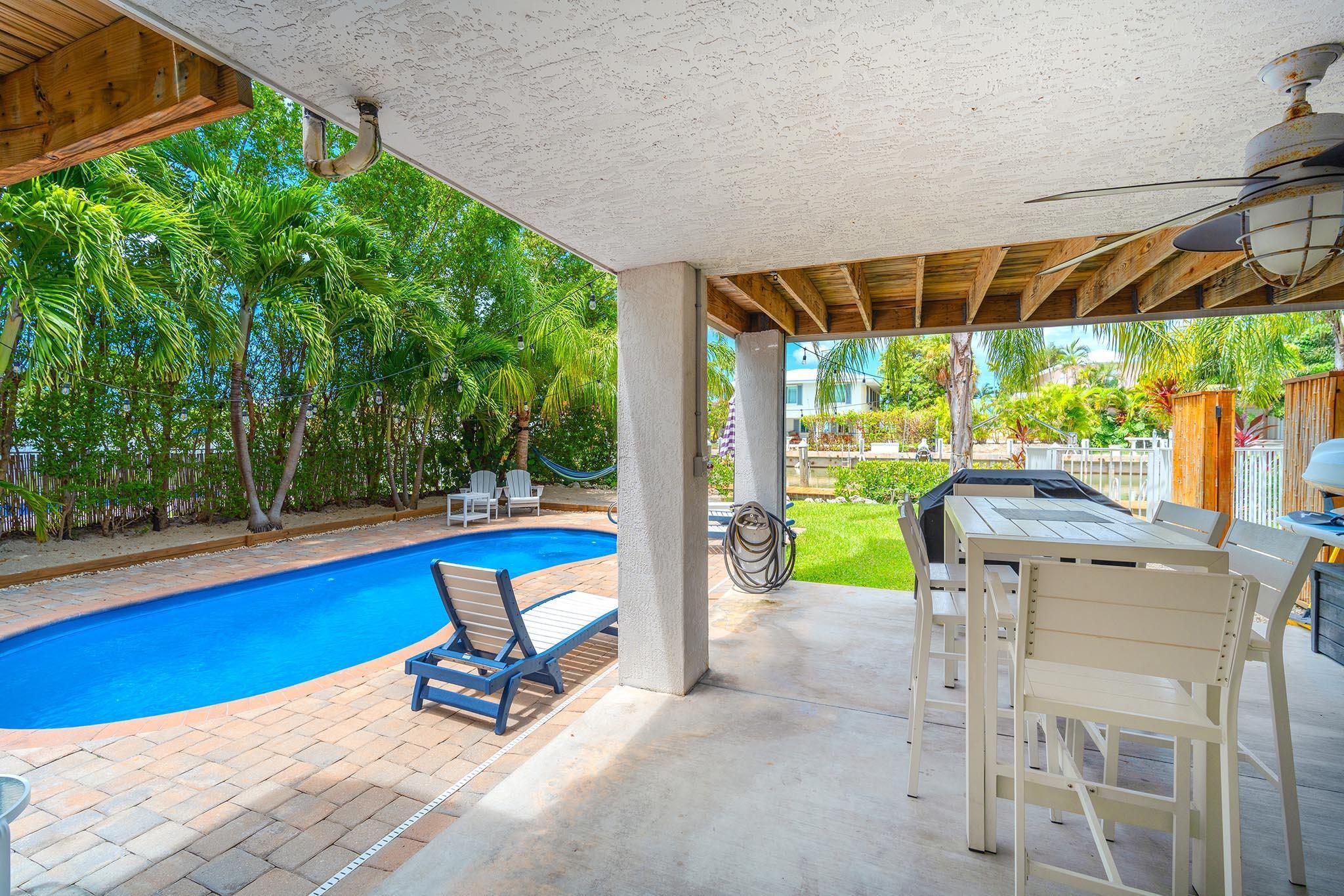 217 Sombrero Beach Road, Unit 1 & 2 Marathon, FL 33050 - Photo 63 of 67 a view of a swimming pool with a patio