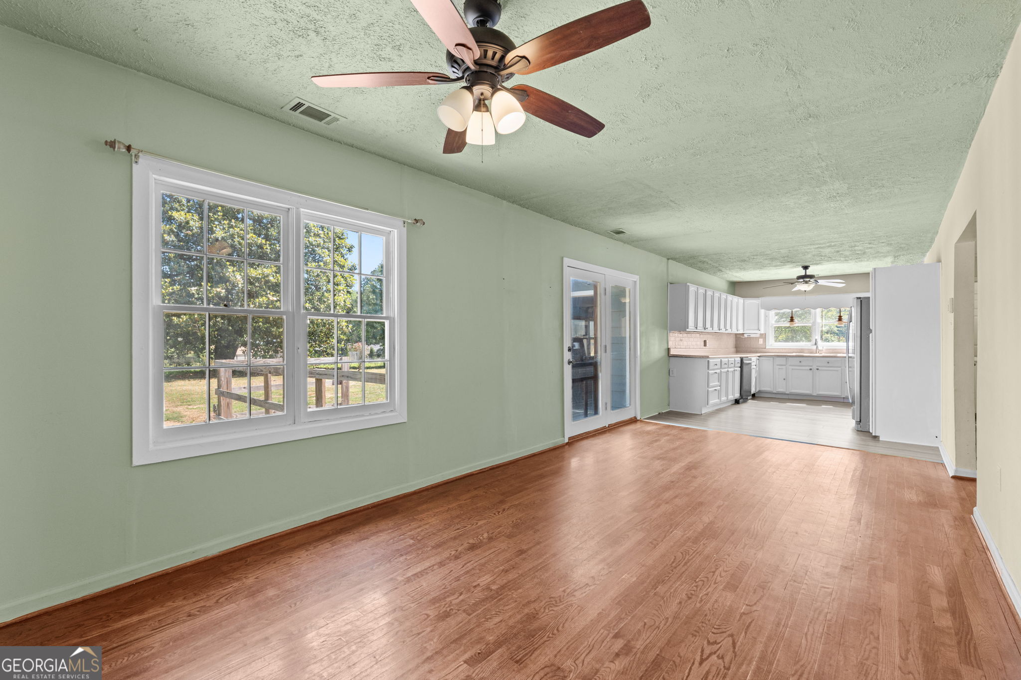 49 Frost Road Bowdon, GA 30108 - Photo 18 of 60 a view of an empty room with window and wooden floor