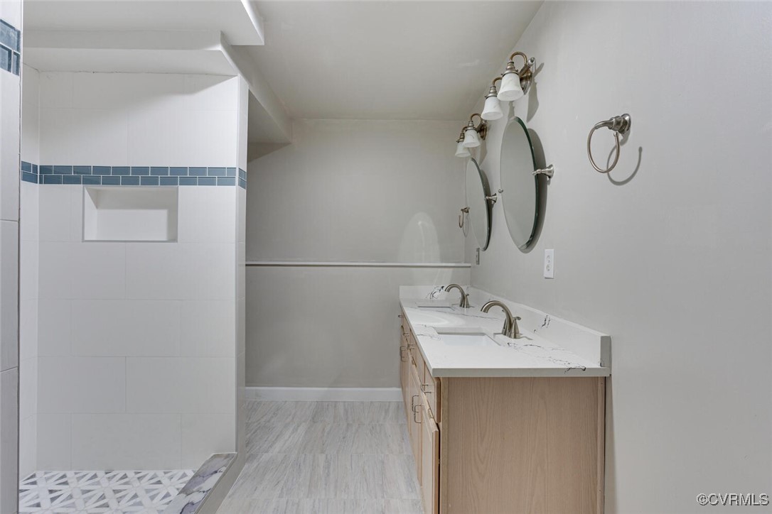 2314 Cox Road Henrico, VA 23233 - Photo 41 of 50 Bathroom featuring a shower, hardwood / wood-style