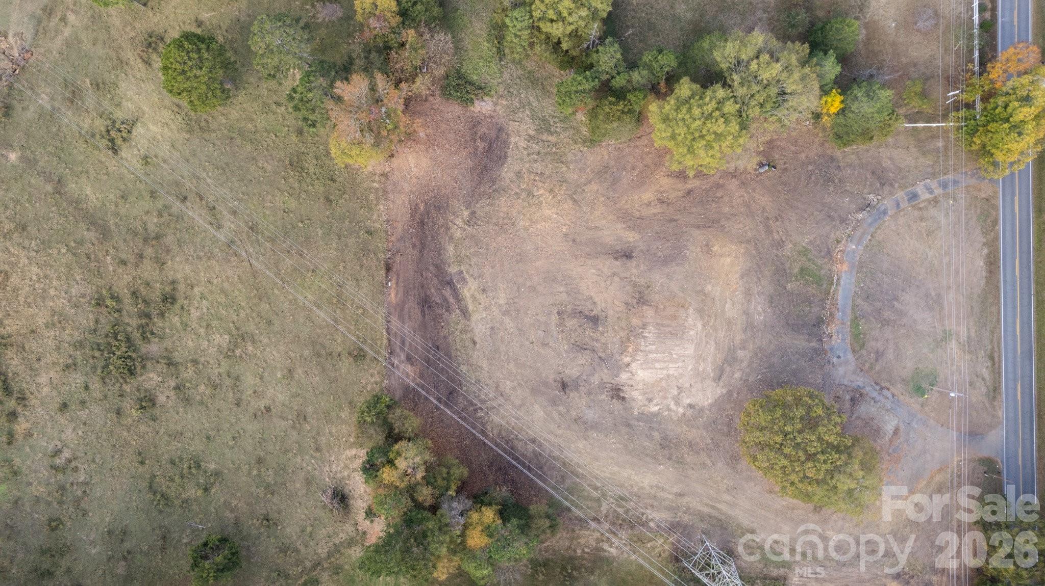 13820 East Rocky River Road, Unit 1 Davidson, NC 28036 - Photo 2 of 10 a view of a plant with a wall