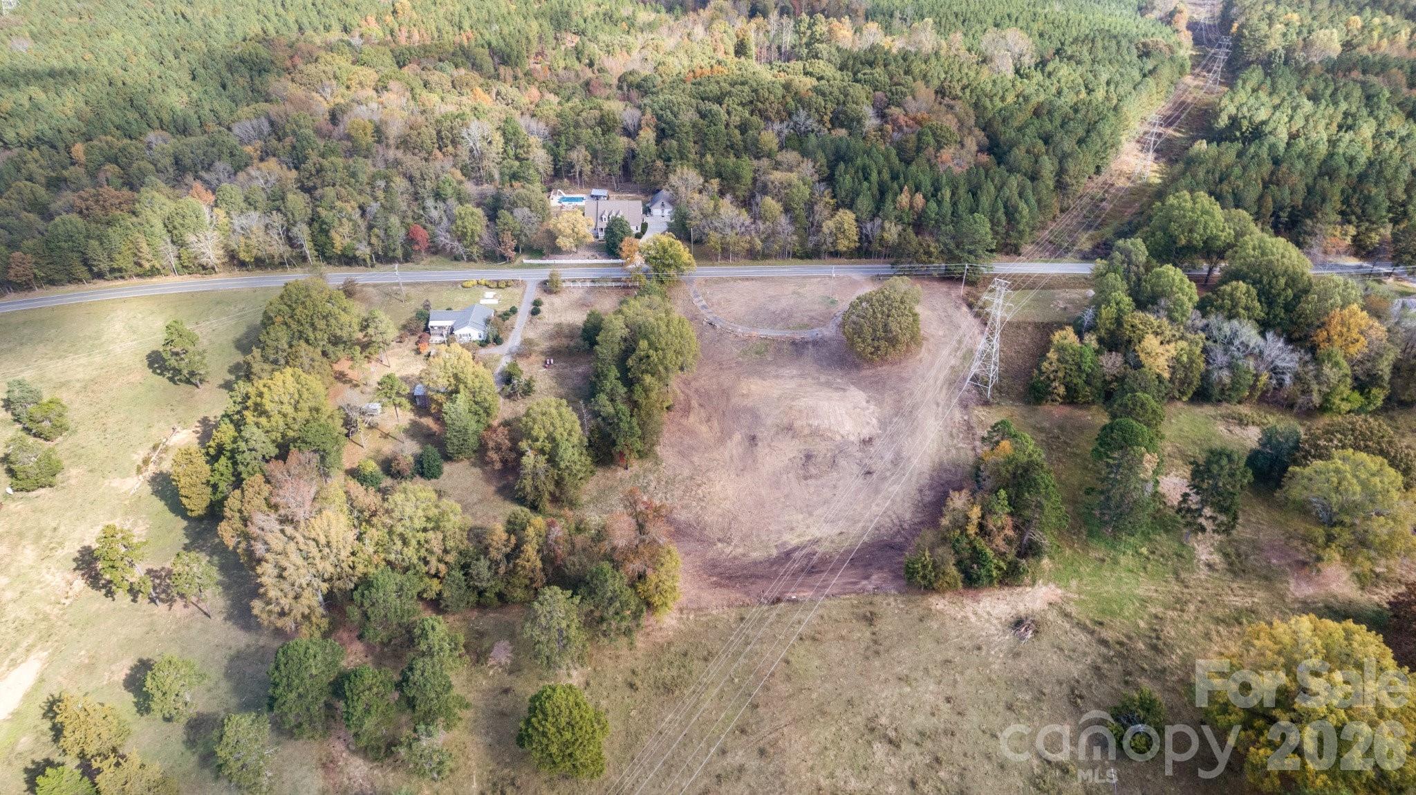 13820 East Rocky River Road, Unit 1 Davidson, NC 28036 - Photo 3 of 10 a view of a yard with large trees