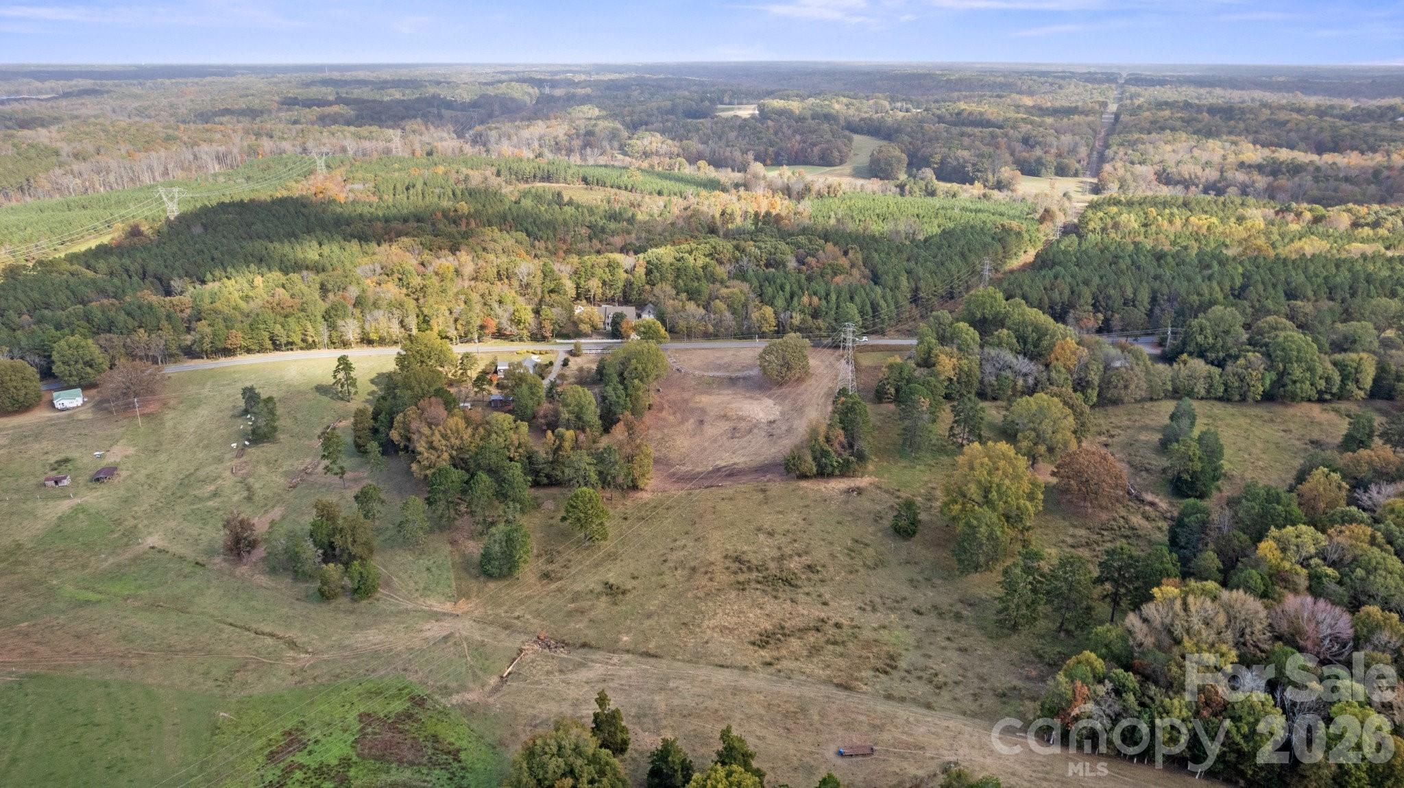 13820 East Rocky River Road, Unit 1 Davidson, NC 28036 - Photo 5 of 10 an aerial view of residential houses with outdoor space and trees