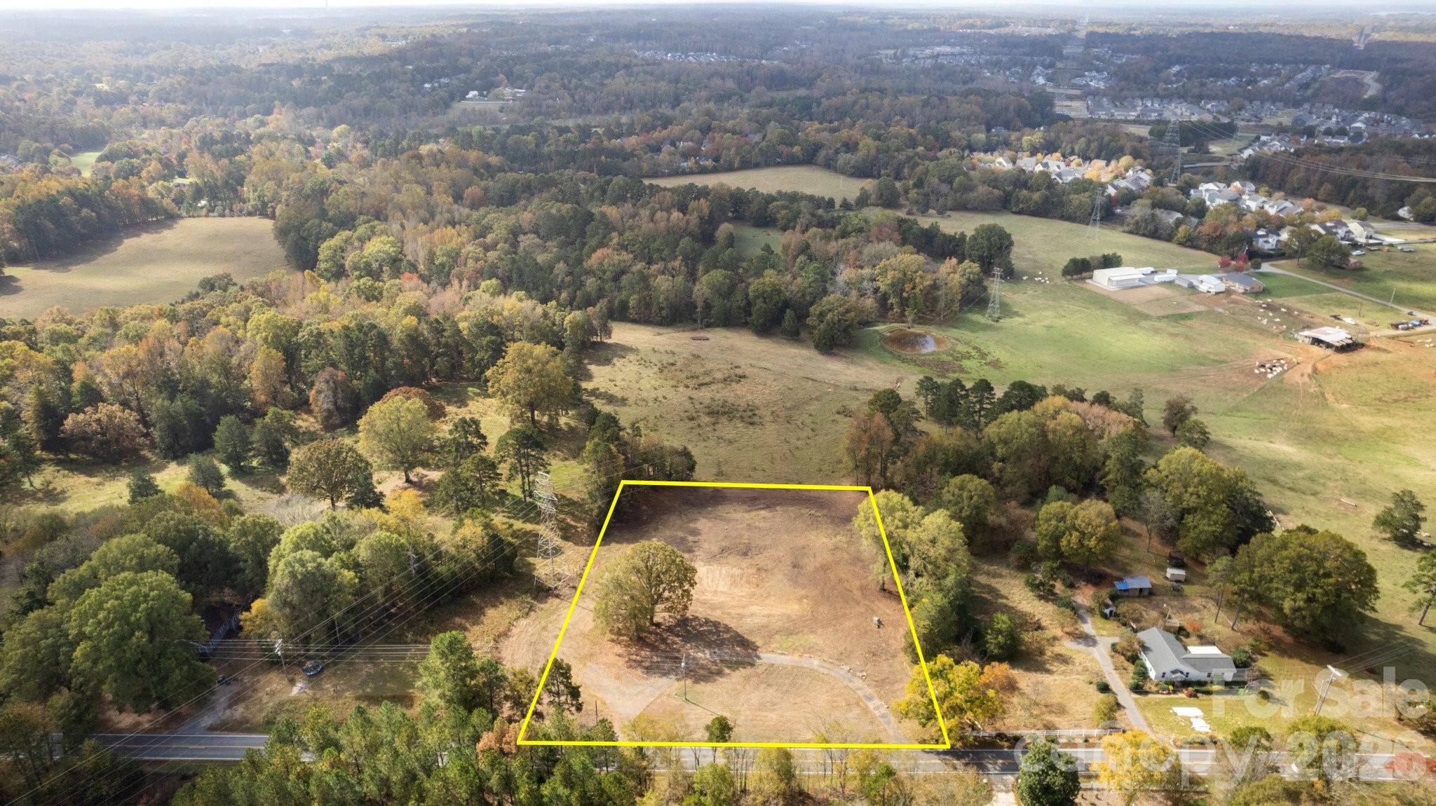 13820 East Rocky River Road, Unit 1 Davidson, NC 28036 - Photo 8 of 10 an aerial view of residential houses with outdoor space
