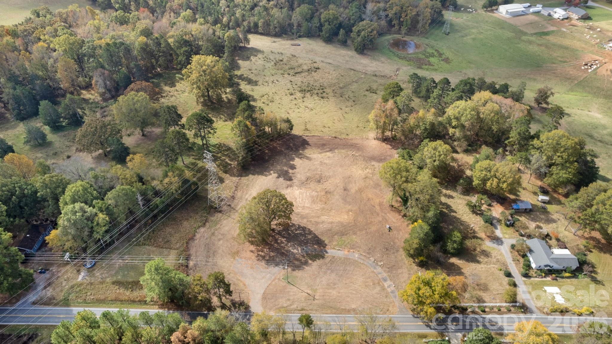 13820 East Rocky River Road, Unit 1 Davidson, NC 28036 - Photo 9 of 10 a aerial view of a house with a yard